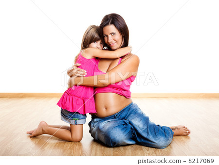 Pregnant woman with her daughter 8217069