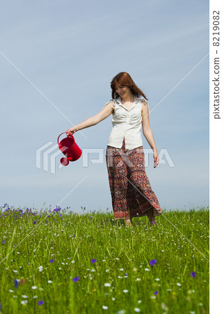 Watering the flowers Watering the flowers 8219082