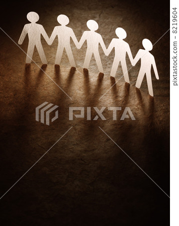 Group of paper people holding hands. Group of paper people holding hands. 8219604