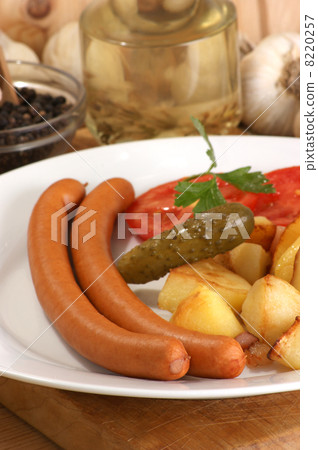 roasted potato with two home made sausages 8220257