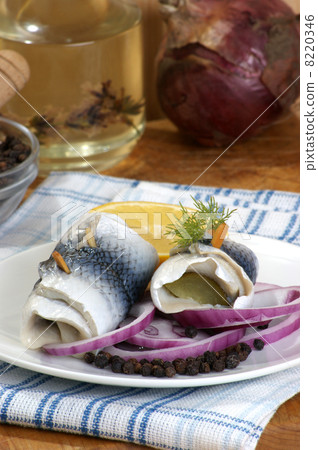 some fresh organic rollmops on a white plate some fresh organic rollmops on a white plate 8220346