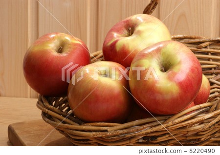 green and red organic apple in a basket green and red organic apple in a basket 8220490