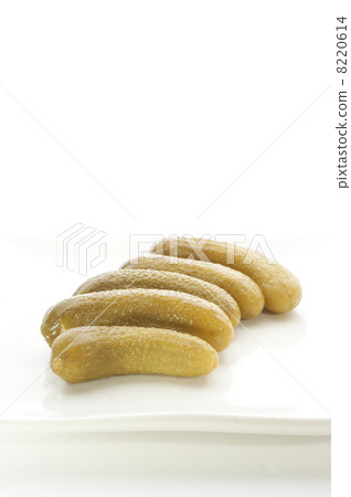 five gherkins on one white plate 8220614