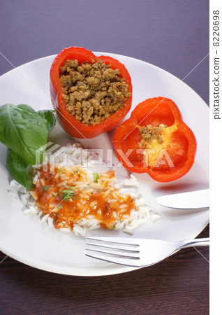 Red mince filled paprika with basil leaf, rice and sauce 8220698