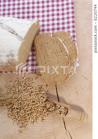 Cottage loaf and cereal on a timber background 8220744