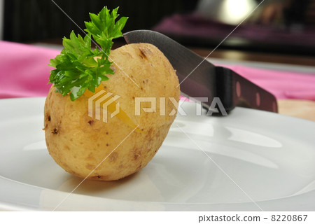 boiled organic potato with some parsley and knife boiled organic potato with some parsley and knife 8220867
