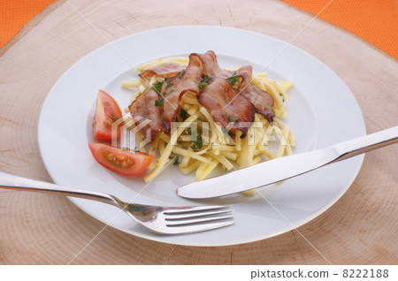 Pasta with tomato and bacon on a plate Pasta with tomato and bacon on a plate 8222188