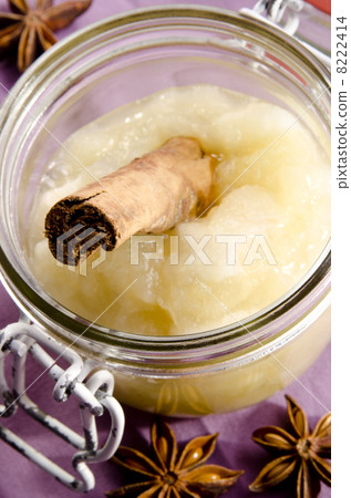 apple sauce with a cinnamon stick in a glass apple sauce with a cinnamon stick in a glass 8222414