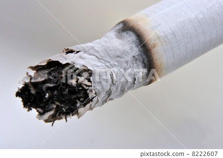 one unhealthy cigarette in a glass ashtray 8222607