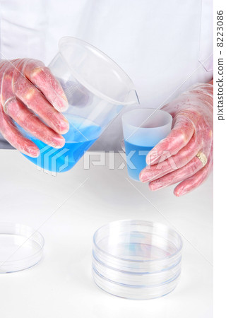 some blue liquid in two chemical container 8223086