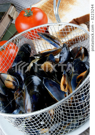 cooked mussels in a colander with tomato cooked mussels in a colander with tomato 8223244