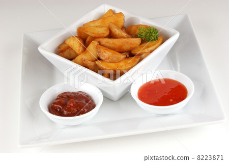 grilled potato wedges with home made spicy sauce 8223871
