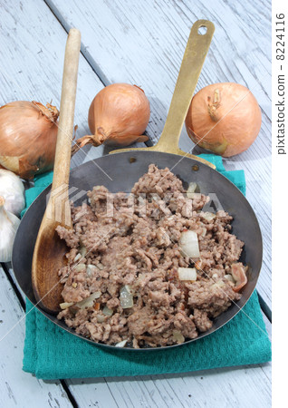 fried ground beef in a rustic brass pan fried ground beef in a rustic brass pan 8224116