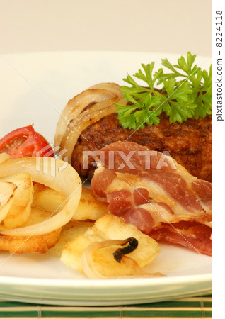 rissole with grilled bacon and onion on a plate rissole with grilled bacon and onion on a plate 8224118