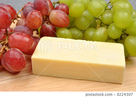 home made cheese with grapes in the background 8224307