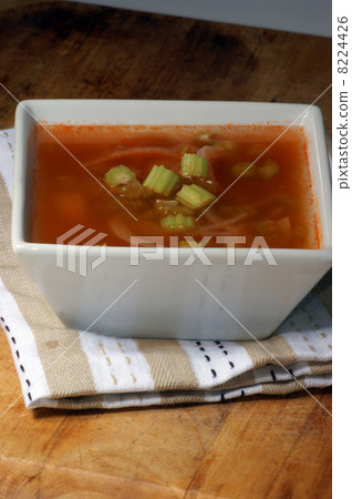 celery and onion soup in a white bowl 8224426