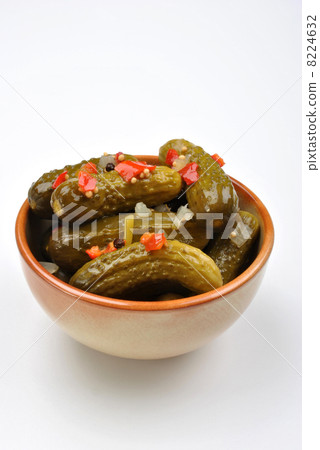 some organic sour gherkin and a white background some organic sour gherkin and a white background 8224632