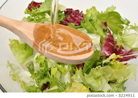 organic salad in a bowl with vegetable oil organic salad in a bowl with vegetable oil 8224911