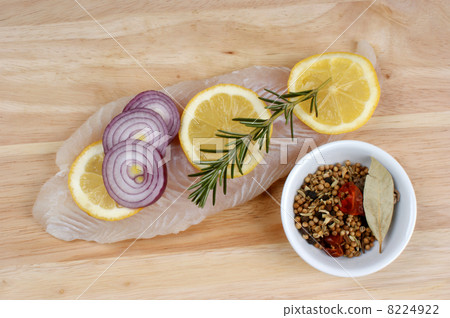raw vietnamese river cobbler fillet on a timber board 8224922