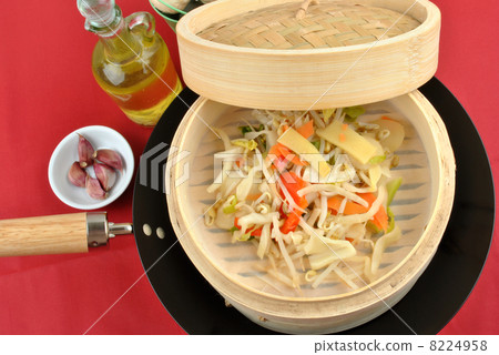 asian stir fry mix in a bamboo steamer 8224958
