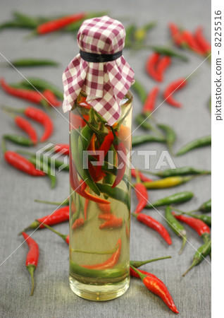 olive oil with some green and red chili olive oil with some green and red chili 8225516