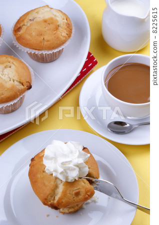 home made scone with cream on a plate 8225615