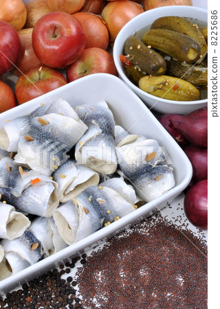 some fresh organic rollmops in a white bowl 8225686