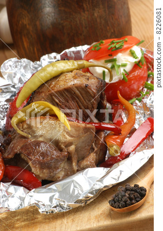 braised meat in tinfoil with grilled paprika braised meat in tinfoil with grilled paprika 8226081