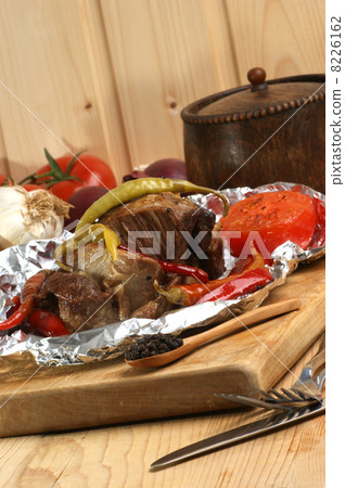 braised meat in tinfoil with grilled paprika 8226162