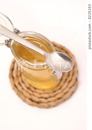 glass filled with sweet honey glass filled with sweet honey 8226163