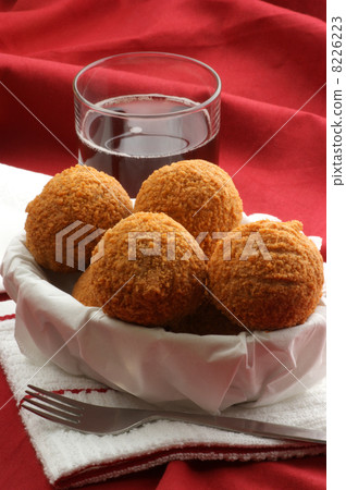 scottish eggs in a bowl with a drink 8226223