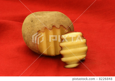 one cut organic fresh potato and red background one cut organic fresh potato and red background 8226848