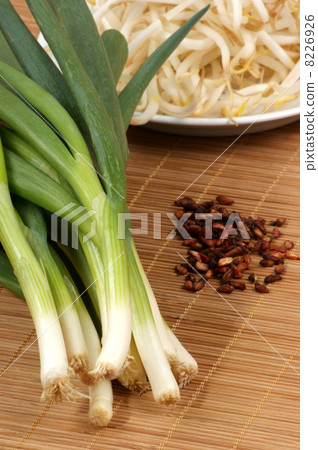 organic spring onion and some pomegranate seed organic spring onion and some pomegranate seed 8226926
