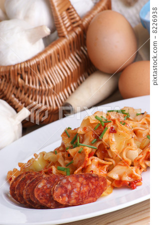 home made noodle with some slices paprika salami home made noodle with some slices paprika salami 8226938