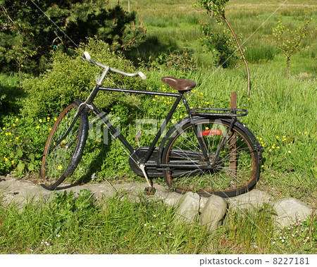 old broken black bike beside the road old broken black bike beside the road 8227181