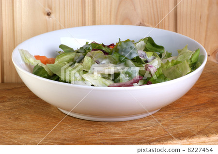fresh organic summer salad in a white bowl fresh organic summer salad in a white bowl 8227454