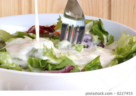 fresh organic summer salad in a white bowl 8227455