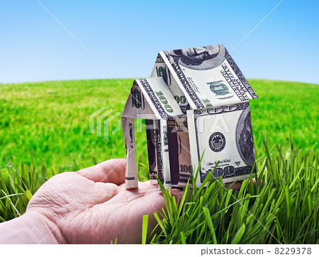 House made of money in hand 8229378