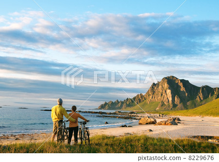 two cyclists relax biking outdoors two cyclists relax biking outdoors 8229676