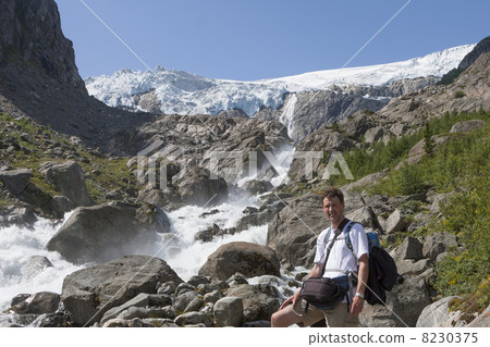 Man and a waterfall (Buarbreen glacier, Folgefonna National Park Man and a waterfall (Buarbreen glacier, Folgefonna National Park 8230375