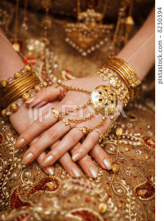 Hands of a bride in a traditional wedding jewelry. Sri Lanka Hands of a bride in a traditional wedding jewelry. Sri Lanka 8230394