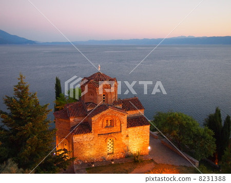 A church with a lake back 8231388