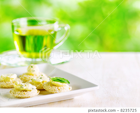 Several canapes and cup of herbal tea. Several canapes and cup of herbal tea. 8235725