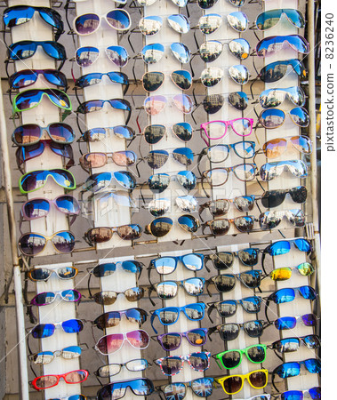 Many sunglasses on display in shop Many sunglasses on display in shop 8236240
