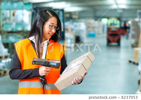 worker scans package in warehouse of forwarding worker scans package in warehouse of forwarding 8237053
