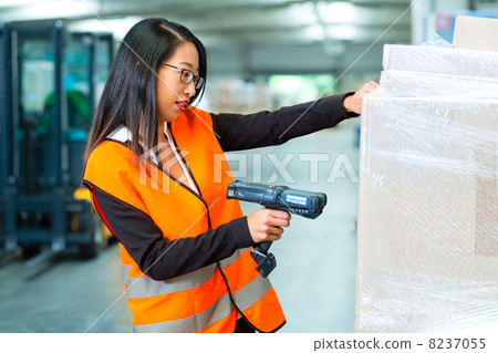 worker scans package in warehouse of forwarding worker scans package in warehouse of forwarding 8237055