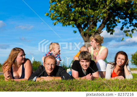 Family and multi-generation - fun on meadow in summer 8237216