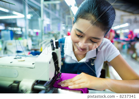Indonesian seamstress in a textile factory 8237341