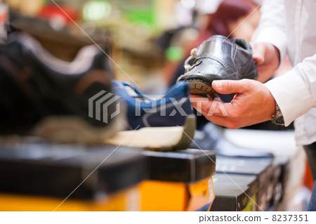 Customer Holding Formal Shoe at Supermarket Customer Holding Formal Shoe at Supermarket 8237351
