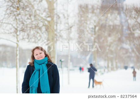 Smiling girl enjoying rare snowy day in Paris Smiling girl enjoying rare snowy day in Paris 8237564